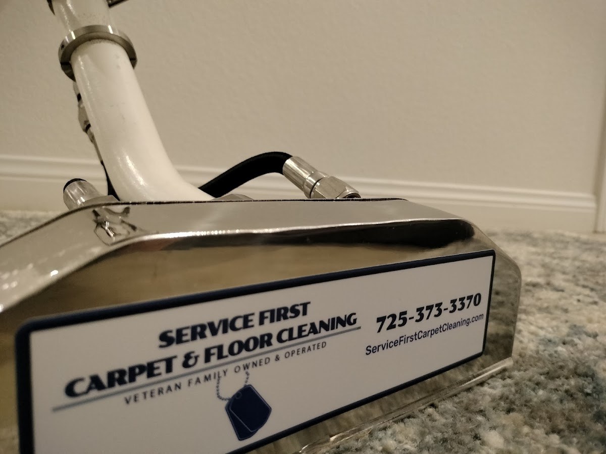 Service First Carpet & Floor Cleaning extraction wand with their label